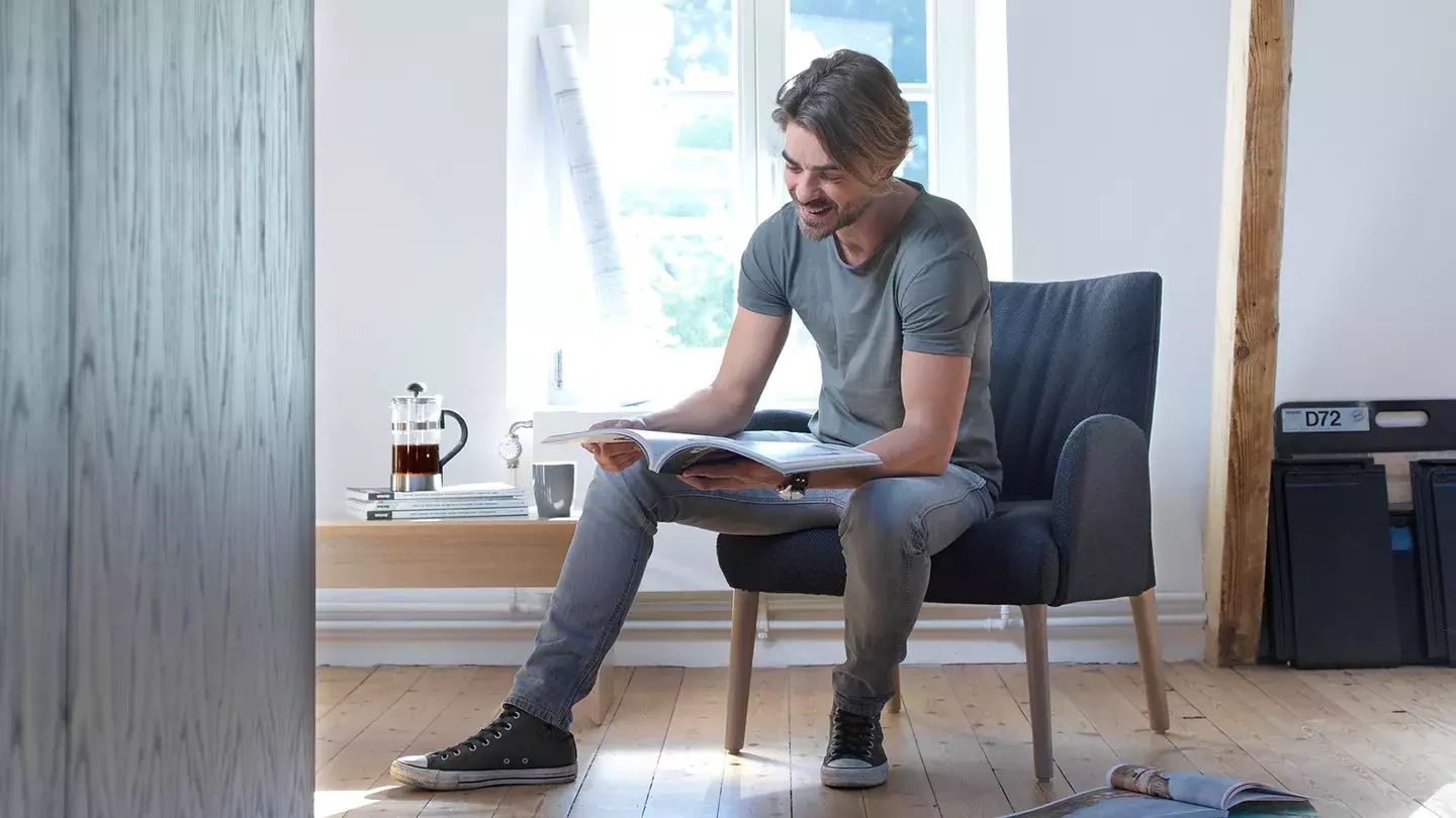 Mobitec :: Enora brown upholstered armchair with armrests, width 69 cm, wooden legs