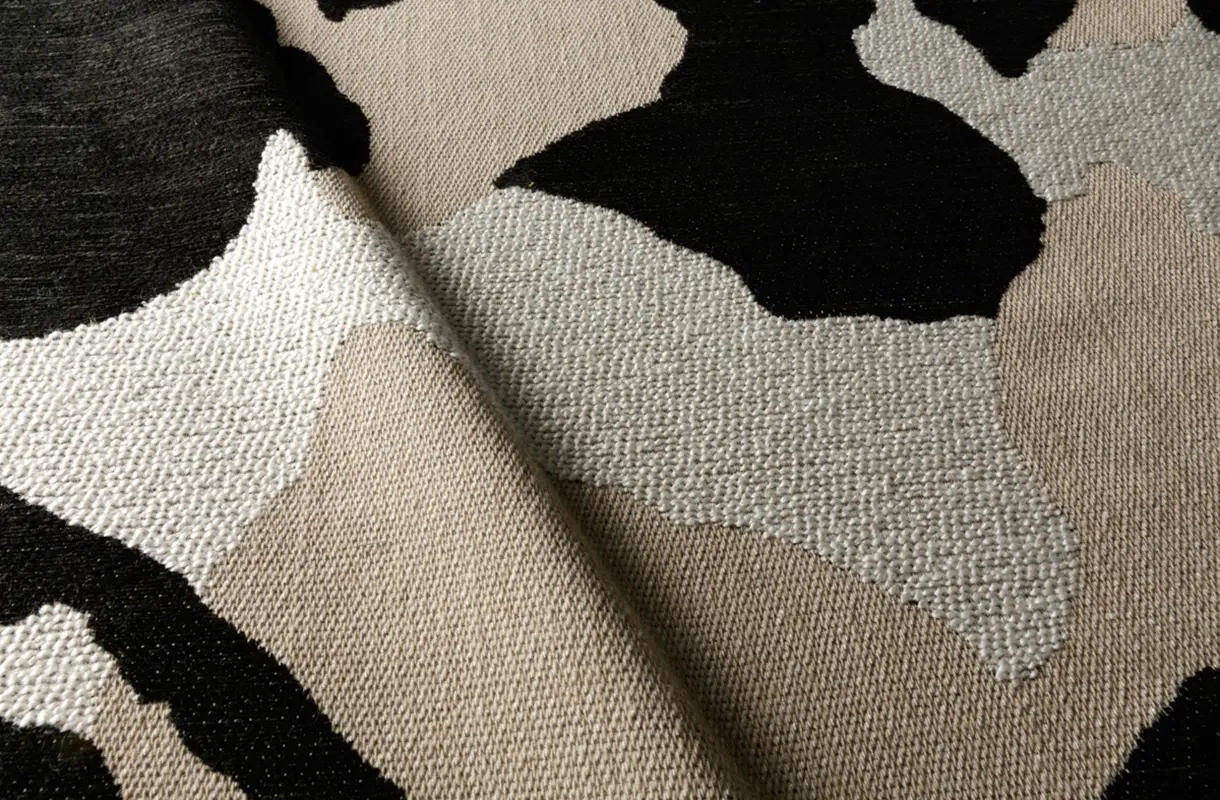 Sits:: Mokka swivel armchair upholstered in patchwork